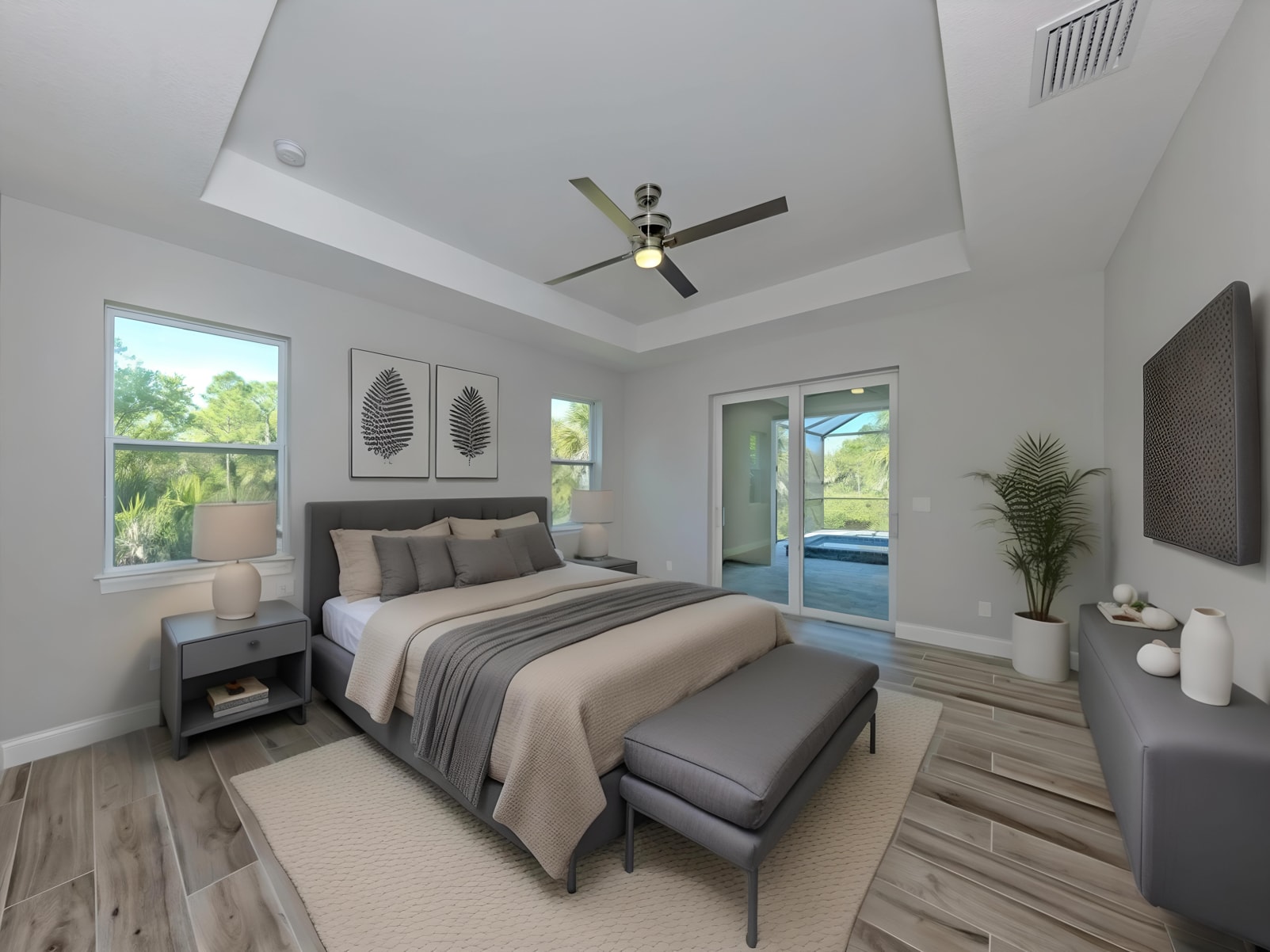 Master bedroom with tray ceiling and pool access